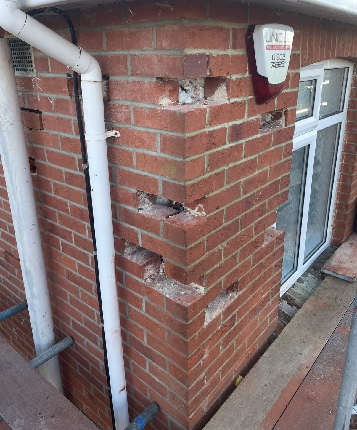 Hairline or stepped cracks in the brickwork