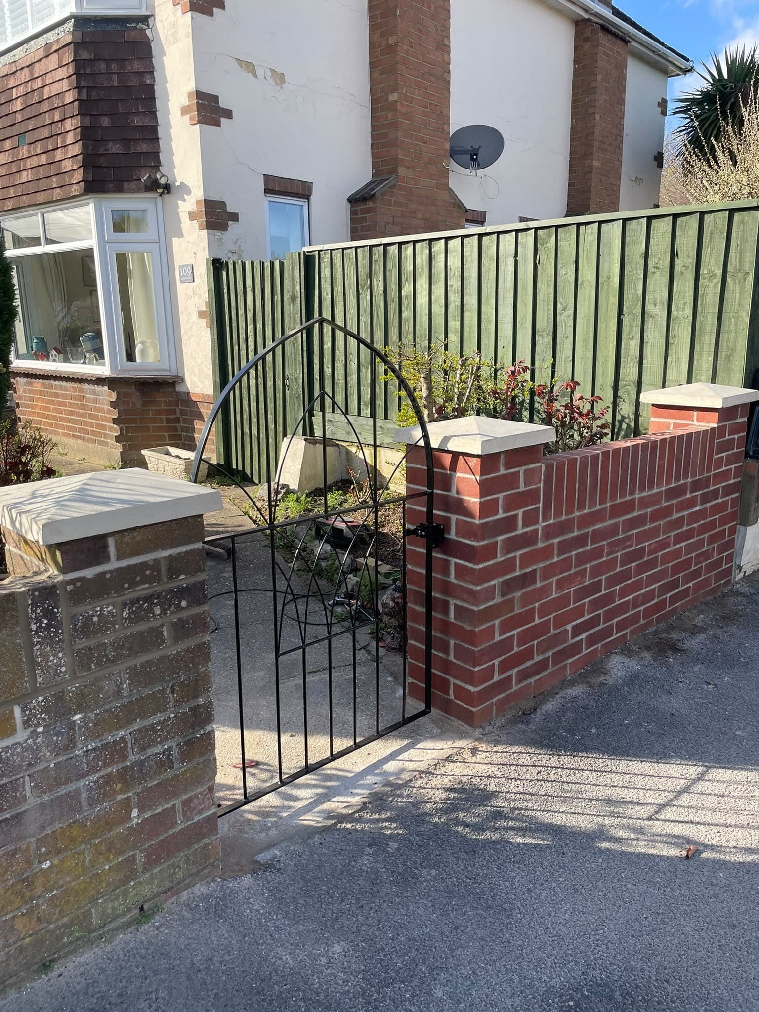 Brick piers iron gate frontage