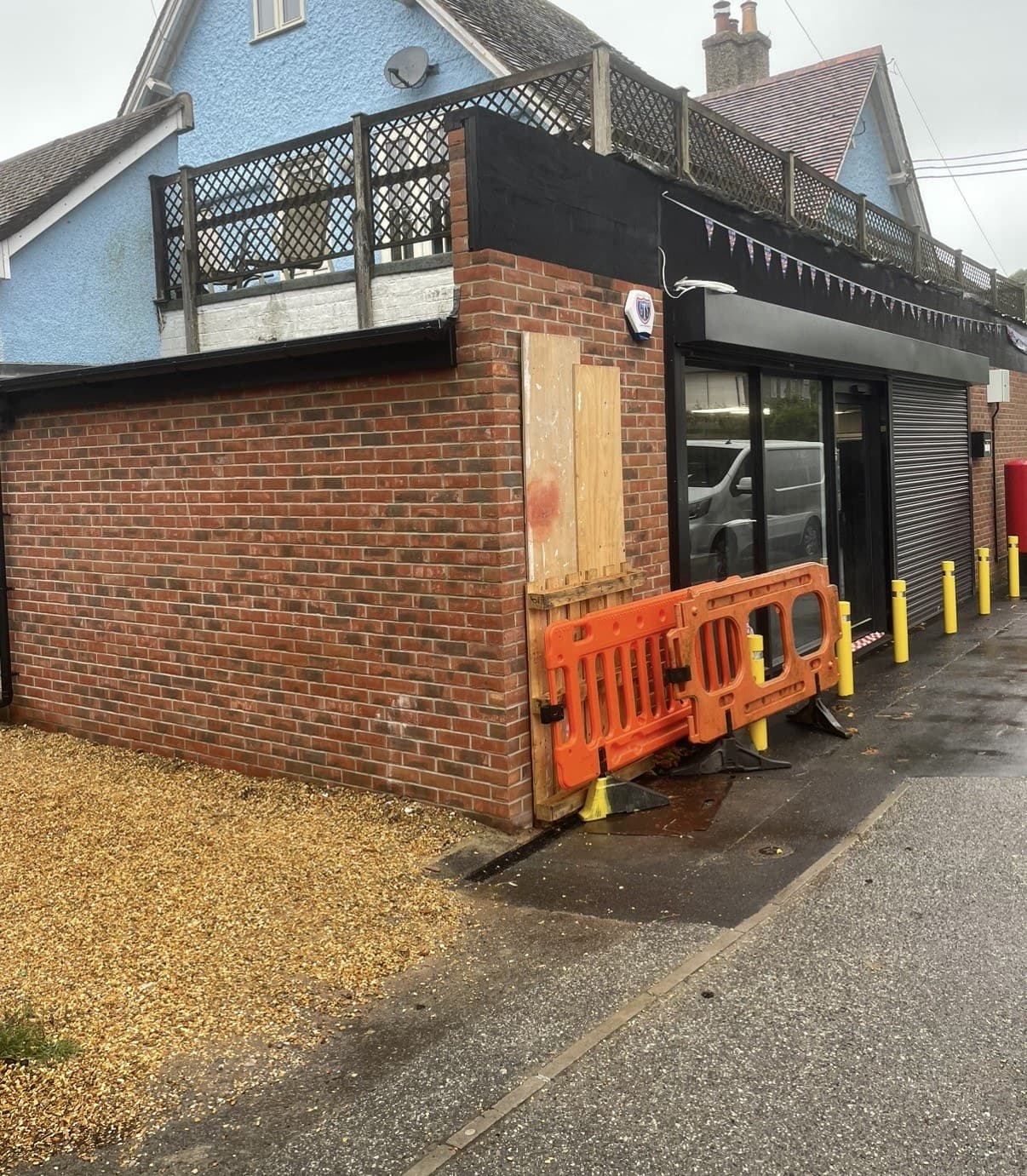 Repaired brickwork at the corner of a shop unit